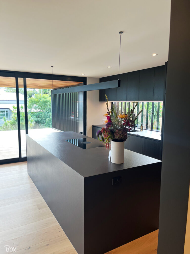 Bold use of colour and strong clean lines define the kitchen space